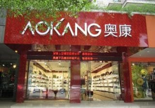 Aokang in crisi: meno produzione, più commercio