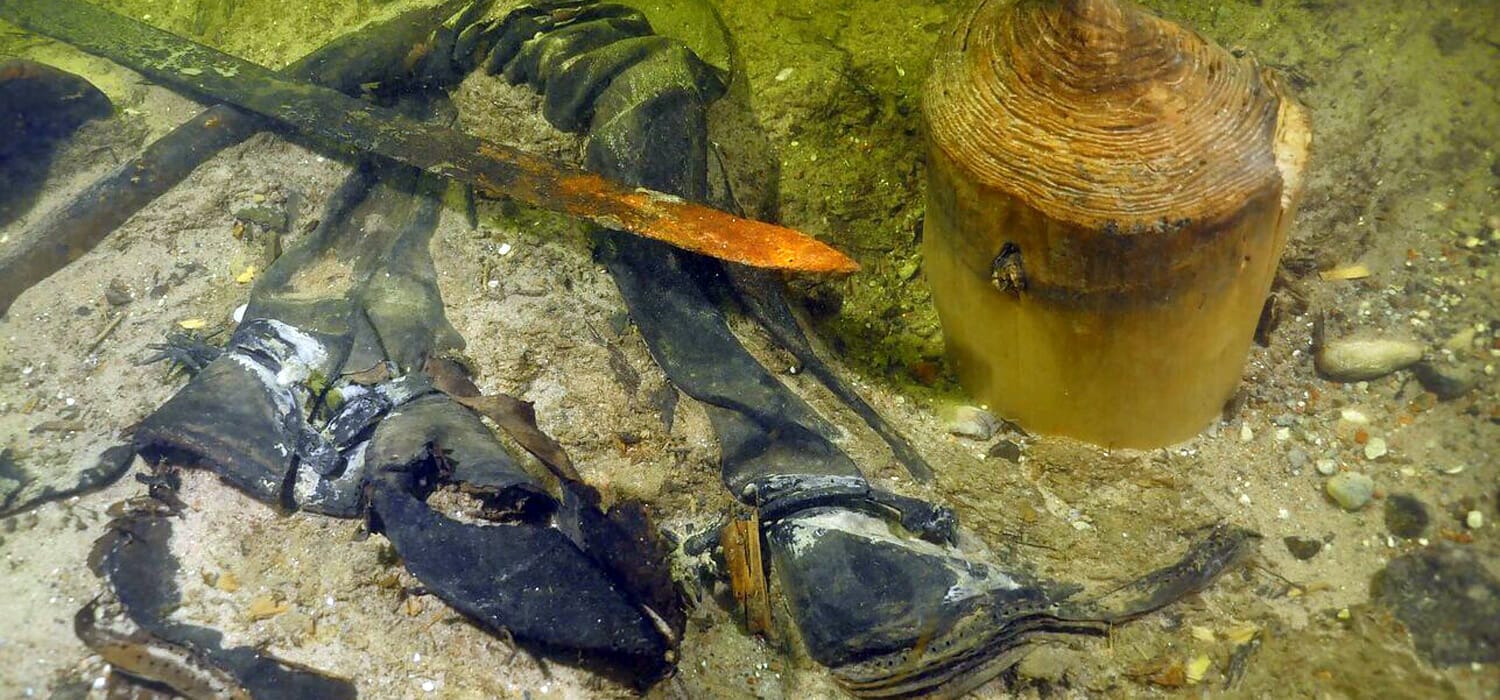 The soldier found at the bottom of a lake after century is still wearing leather boots