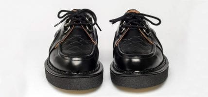 Fred Perry Holdings buys George Cox shoes
