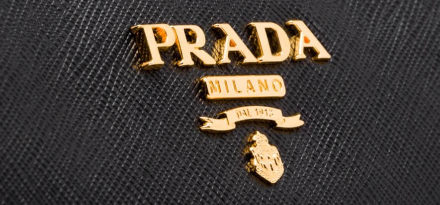 Febbre da M&A: Prada guarda ad Arezzo, gli arabi ad Aston Martin